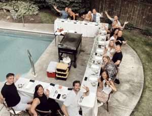 Complete backyard hibachi table and chair setup with chef and grill